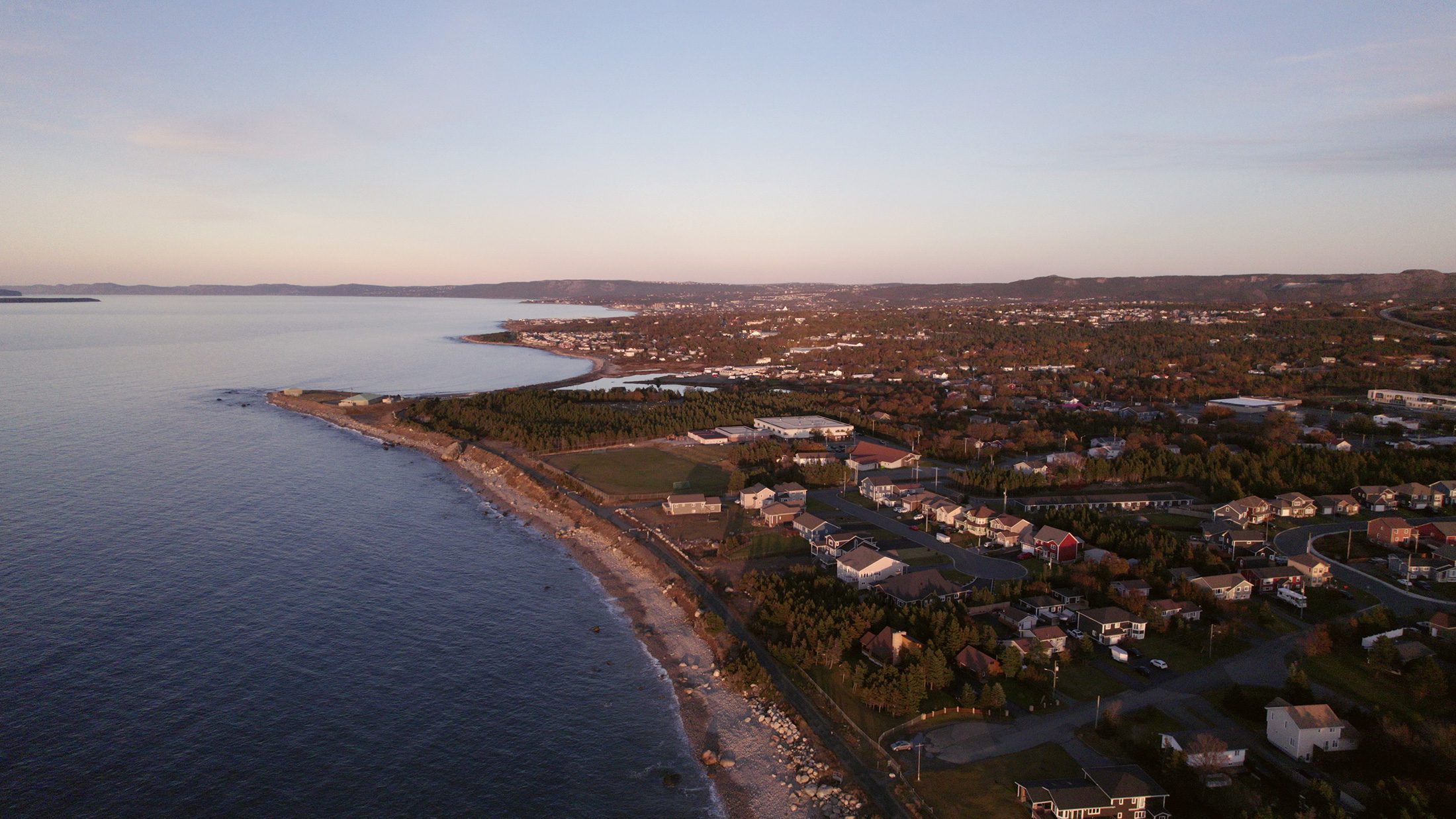 A drone view of the shoreline of Conception Bay South at dusk