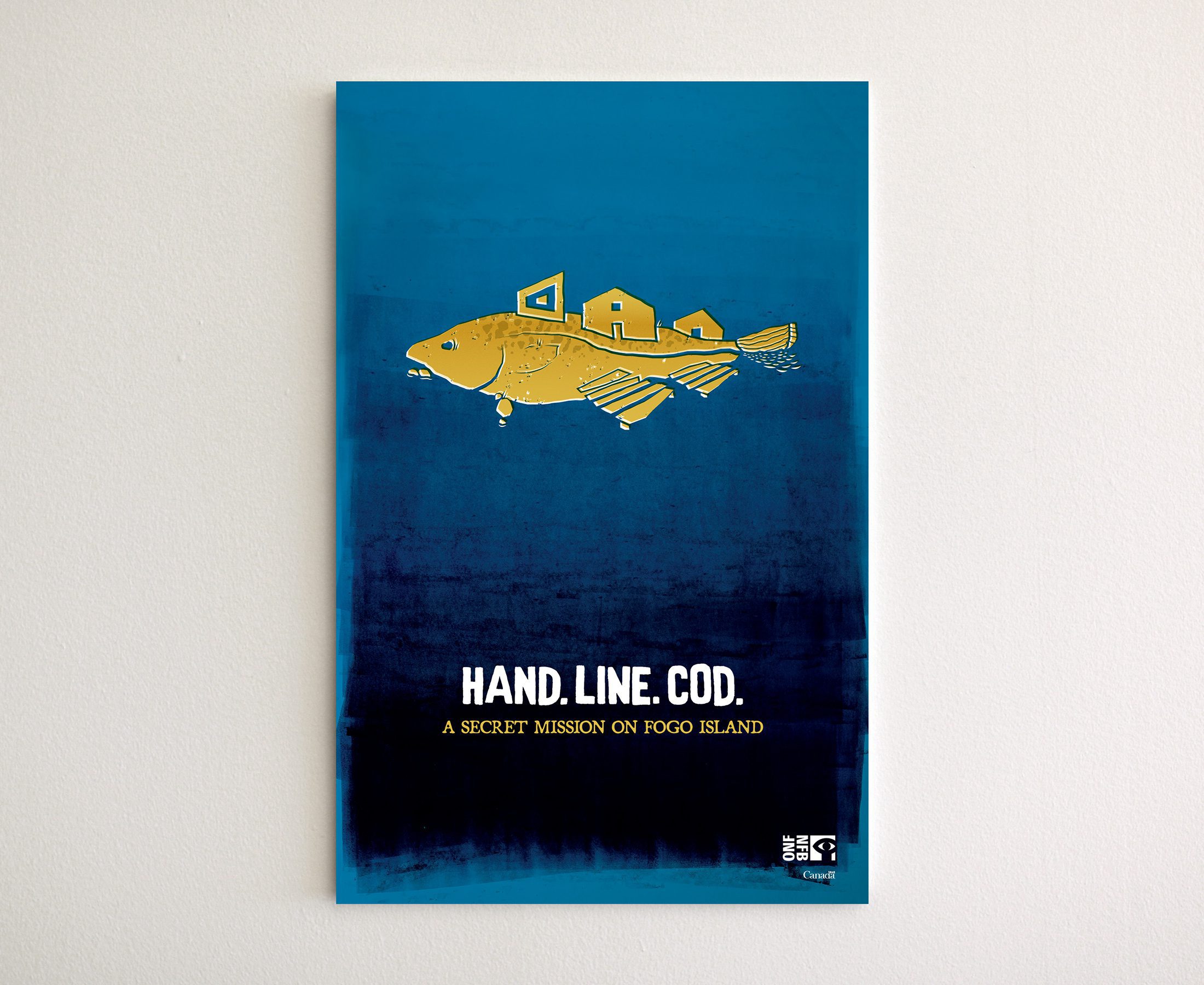 Blue poster featuring an illustrated cod that also looks like an island, on a blank wall