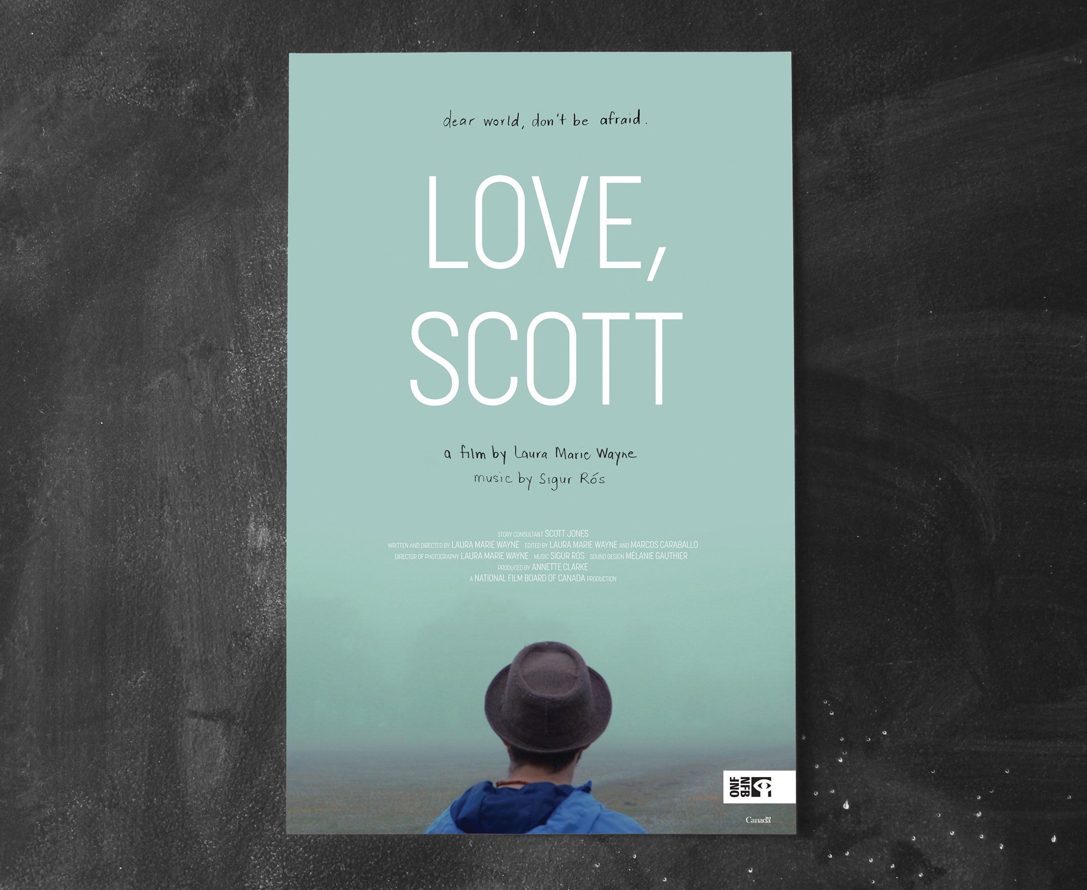 Light teal poster for the film Love, Scott on a dark chalkboard wall